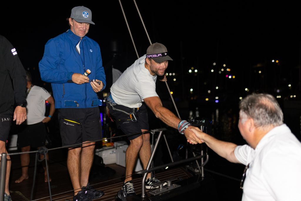 North Sails' Ken Read and team on Swan 115 Jasi - welcomed on the dock by the RORC Race Reporter and Race Team  © Arthur Daniel/RORC