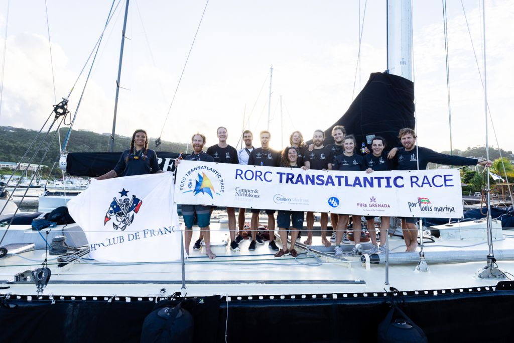 Celebrating after the finish in Grenada. Proudly displaying the flag of the Yacht Club de France, the Pen Duick crew of 12 were the youngest in the race © Arthur Daniel/RORC