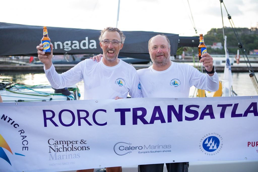 Richard Palmer and Jeremy Waitt celebrate dockside at Camper & Nicholsons Port Louis Marina © RORC/Arthur Daniel