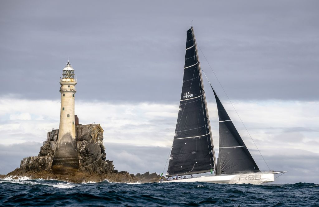 George David's Rambler 88 rounds the legendary Fastnet Rock © ROLEX/Carlo Borlenghi 